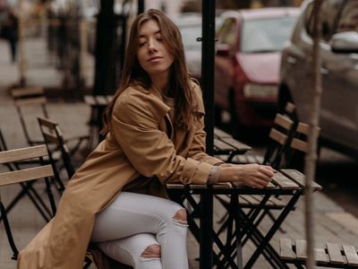 A person sitting in a meditative pose at the end of a session.