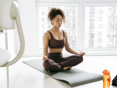 Calm setting with a yoga mat, suggesting a space for breathing exercises.